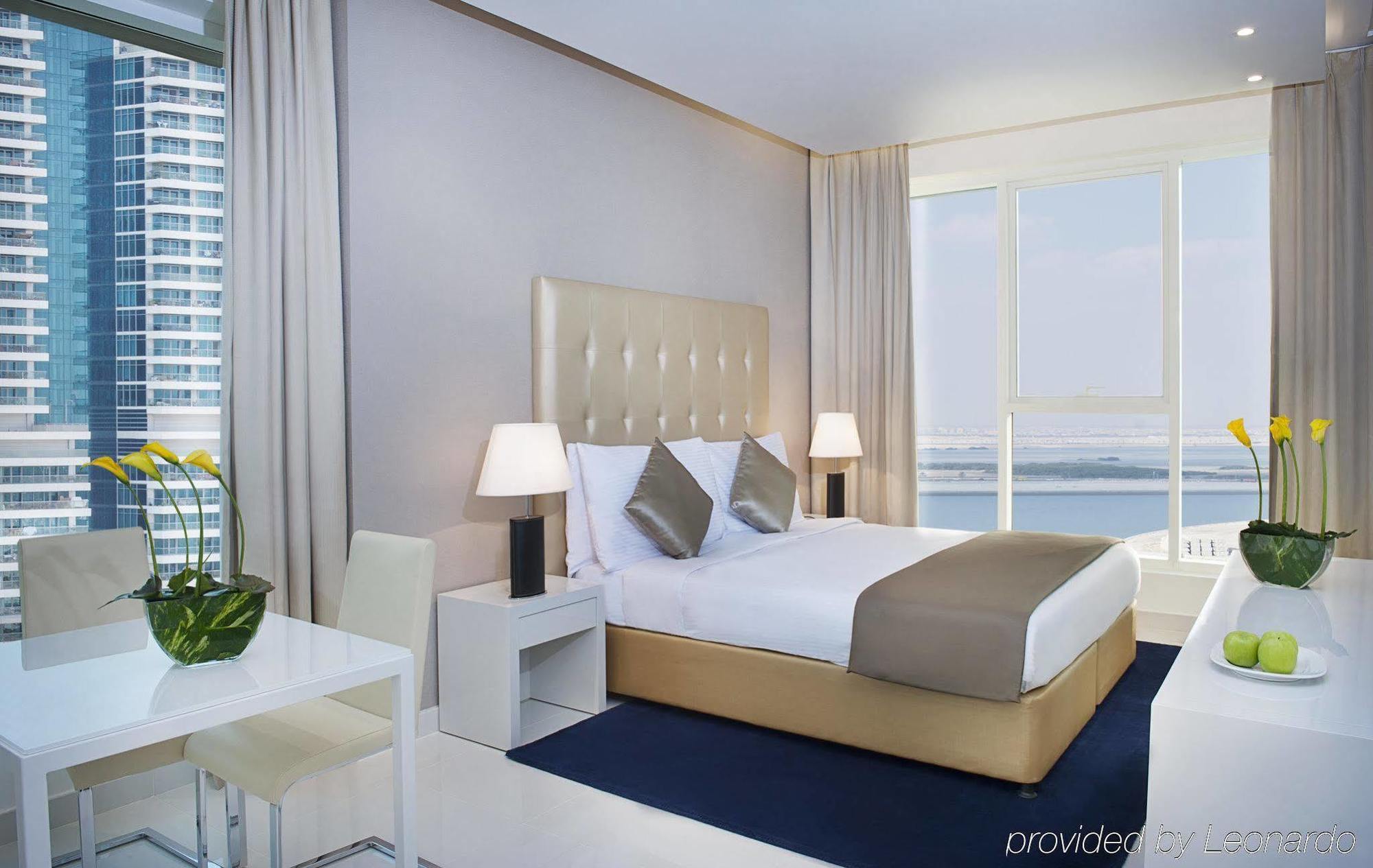 Damac Maison The Vogue 迪拜 外观 照片 A bedroom at the Address Downtown Hotel